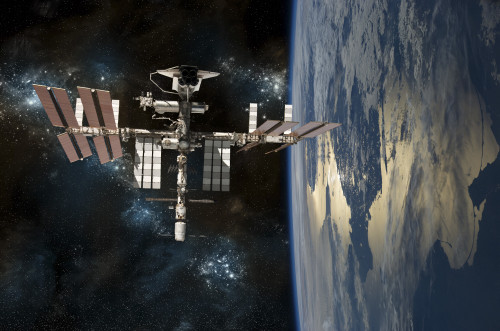 A depiction of the space shuttle docked at the International Space Station orbiting Earth Poster Print - Item # VARPSTMRC200189S