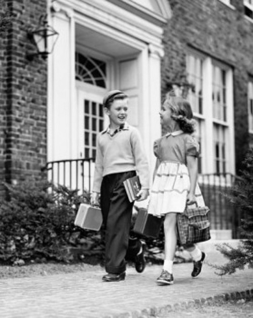 Schoolboy and schoolgirl walking on a walkway Poster Print - Item # VARSAL2553321A