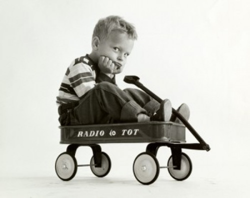 Portrait of a boy sitting in a wagon Poster Print - Item # VARSAL2553193
