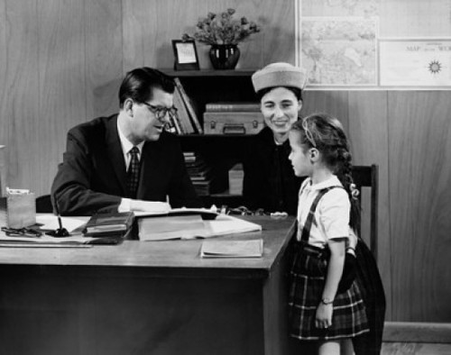 Girl with her mother in front of a school principal Poster Print - Item # VARSAL2553407