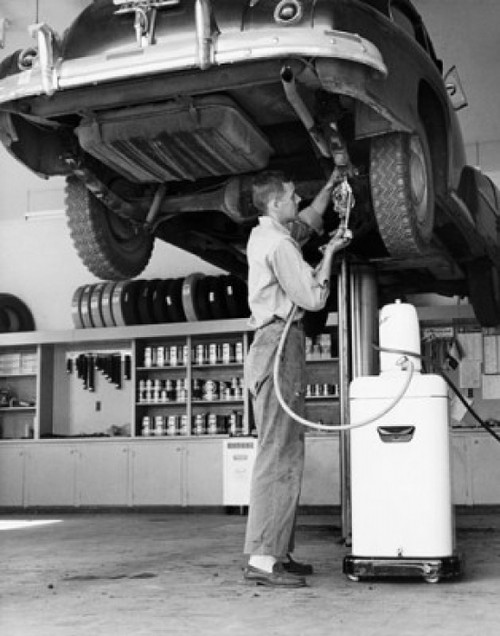Mid adult man repairing a car in an auto repair shop Poster Print - Item # VARSAL2555817