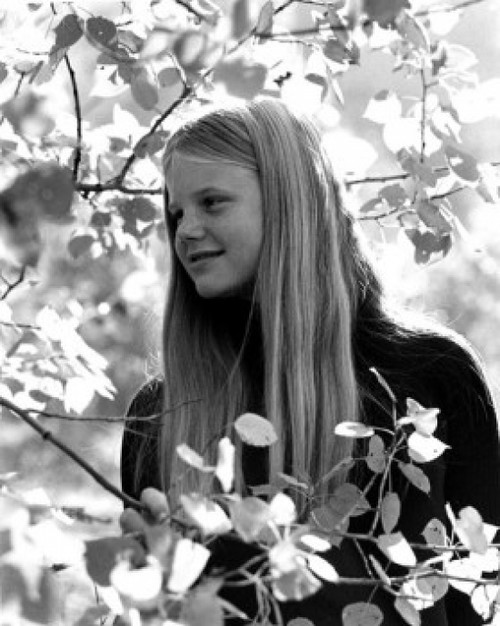 Girl standing among leaves on tree Poster Print - Item # VARSAL25514052