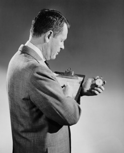 Side profile of a businessman holding a stopwatch and a clipboard Poster Print - Item # VARSAL25548122