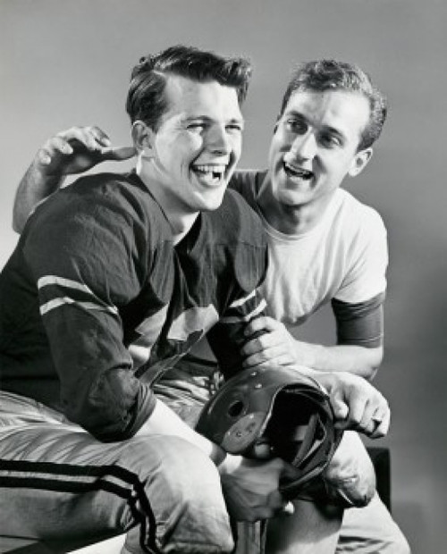 Close-up of two football players sitting together and smiling Poster Print - Item # VARSAL2556069