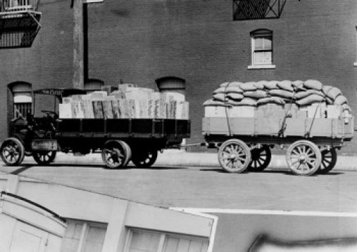 Low angle view of truck attached to cart on road Poster Print - Item # VARSAL25524015