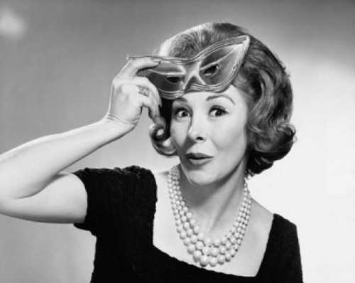 Portrait of a mid adult woman holding a mask Poster Print - Item # VARSAL25526764B Portrait of a mid adult woman holding a mask Poster Print - Item # VARSAL25526764B