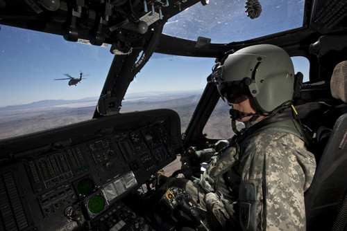 UH-60 Black Hawk pilot keeps a safe distance he follows aircraft en route to Playas Training Area, New Mexico during exercise Angel Thunder 2013 Poster Print - Item # VARPSTTMO100981M