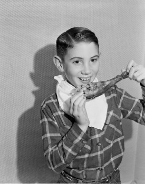 Boy eating turkey leg Poster Print - Item # VARSAL255424467