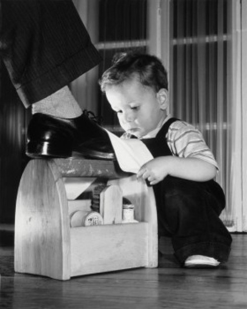Son shining his father's shoe Poster Print - Item # VARSAL2553322
