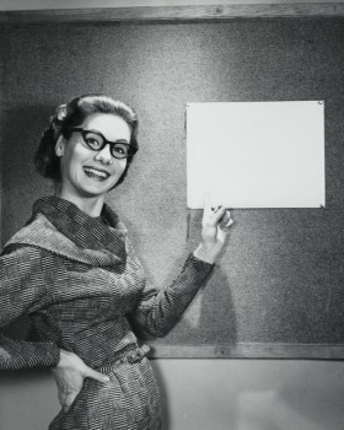 Portrait of a businesswoman pointing at a bulletin board Poster Print