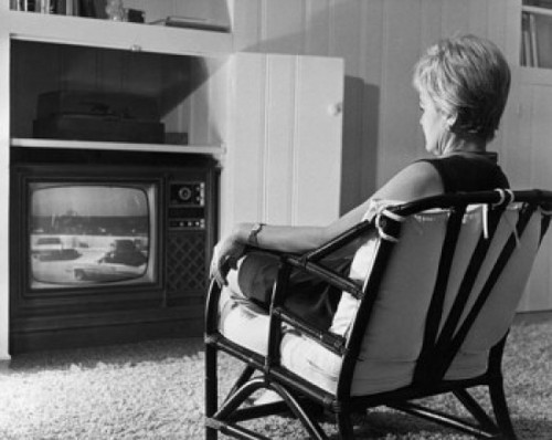 Rear view of a mature woman watching television Poster Print - Item # VARSAL25511278