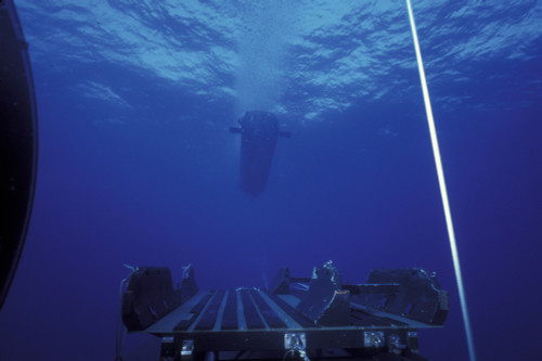 A SEAL Delivery Vehicle approaches the Dry Deck Shelter buoyed rendezvous line as seen from the empty DDS track and cradle system during submarine operations off the coast of Hawaii in 1994. Poster Print - Item # VARPSTWOD100204M