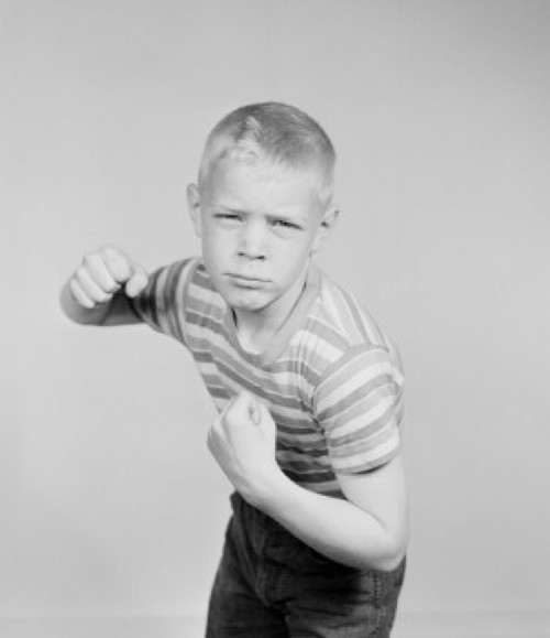 Studio portrait of boy clenching fists Poster Print - Item # VARSAL255422159
