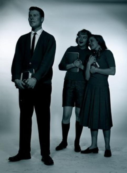 Studio shot of female students gossiping  man in foreground Poster Print - Item # VARSAL255417184