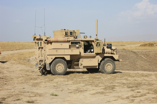A U.S. Army Cougar MRAP vehicle parked overlooking the top of a wadi during a weapons familiarization shoot, Kunduz, Afghanistan Poster Print - Item # VARPSTTMO100323M