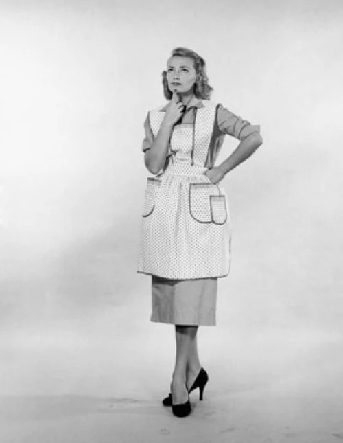Studio shot of young woman standing with hand on chin Poster Print