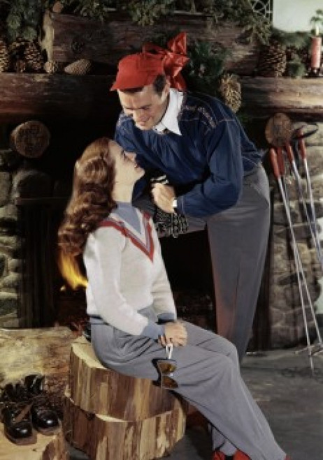 Young couple smiling near a fireplace Poster Print - Item # VARSAL380722247