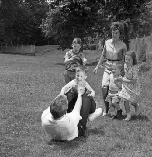 Family with four children playing in backyard Poster Print - Item # VARSAL255420761
