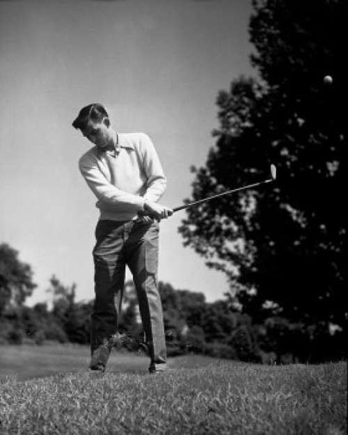 Mid adult man swinging golf club Poster Print - Item # VARSAL25521882