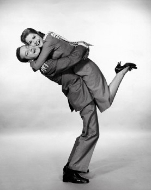 Portrait of a young man lifting a young woman Poster Print - Item # VARSAL2555582