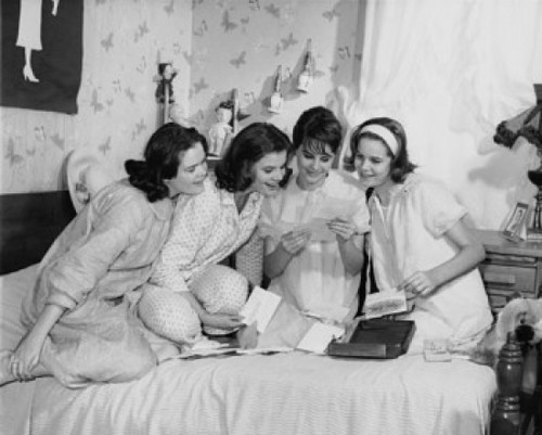 Four teenage girls reading a letter Poster Print - Item # VARSAL25511735