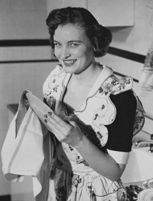 Portrait of a young woman cleaning a plate with a dishcloth Poster Print - Item # VARSAL25541983