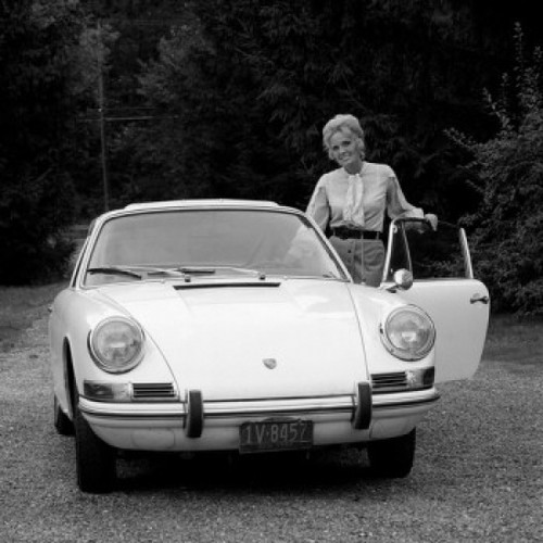 Woman standing by car Poster Print - Item # VARSAL255416910