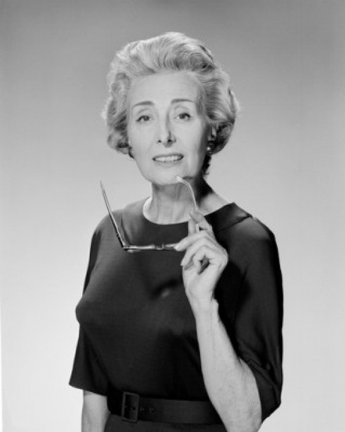 Portrait of senior woman holding glasses Poster Print - Item # VARSAL255416520