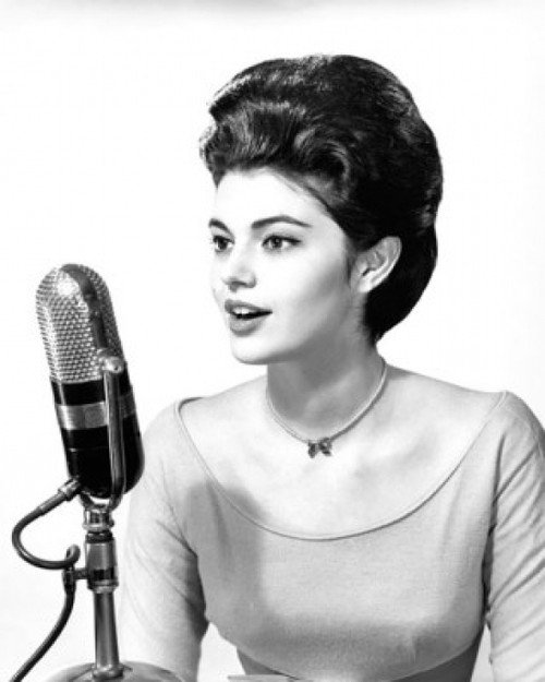 Young woman singing into a microphone Poster Print - Item # VARSAL25523824