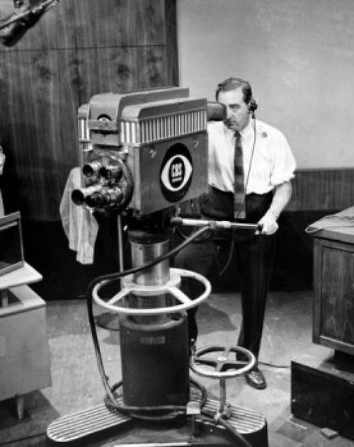 High angle view of a cameraman operating a television camera Poster Print - Item # VARSAL2557827