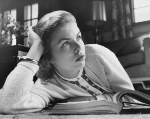 Close-up of a teenage girl lying on the floor with an open book in front of her Poster Print - Item # VARSAL2558577