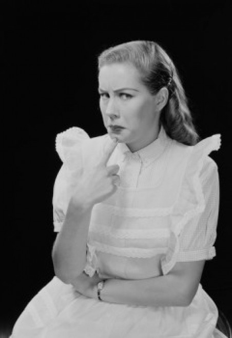 Studio portrait of young woman thinking. Poster Print - Item # VARSAL255422861