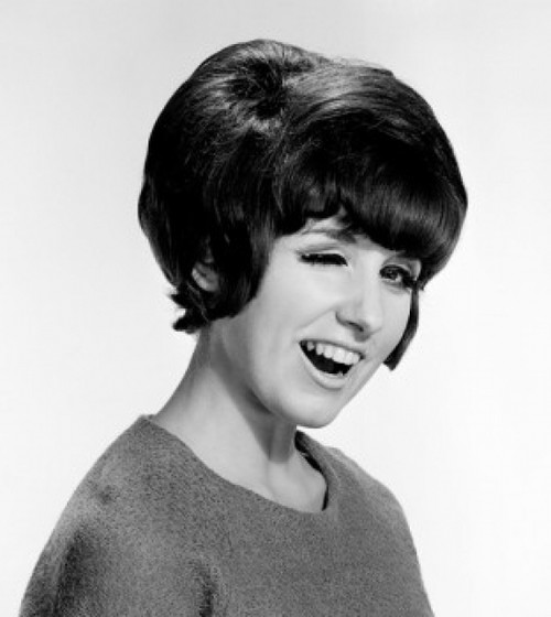 Young woman winking  studio shot Poster Print - Item # VARSAL255417796