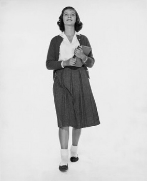 Smiling teenage girl holding a book Poster Print - Item # VARSAL25517535 Smiling teenage girl holding a book Poster Print - Item # VARSAL25517535