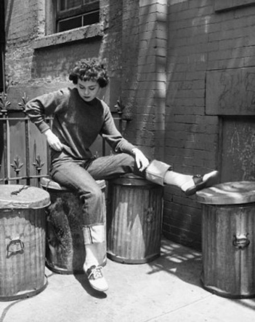 Teenage girl sitting on a garbage bin Poster Print - Item # VARSAL2558620