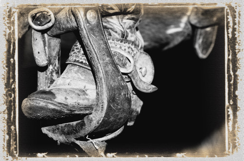 A Black And White Photo Of A Cowboy Boot And Stirrup PosterPrint