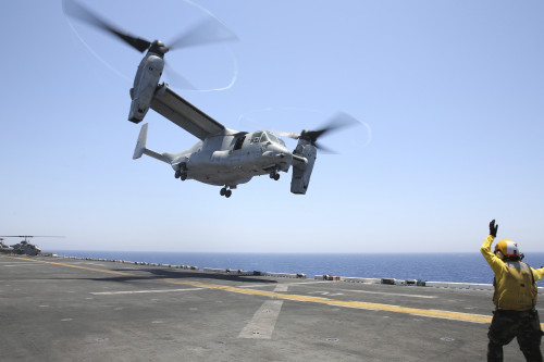 Red Sea, July 23, 2013 - Aviation Boatswain's Mate Airman directs the take-off an MV-22 Osprey from the flight deck of the amphibious assault ship USS Kearsarge Poster Print - Item # VARPSTSTK107726M