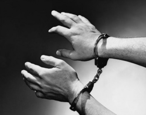 Close-up of man's hand wearing handcuffs Poster Print - Item # VARSAL25522969
