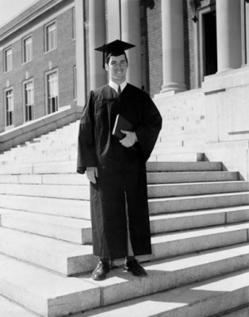 Man in graduation gown holding diploma Poster Print - Item # VARSAL255416292