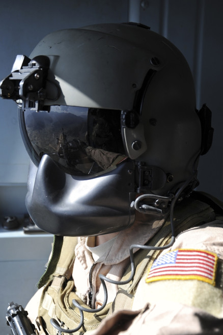 October 9, 2011 - U.S. Air Force flight engineer looks out over Afghanistan while flying in an Afghan Air Force Mi-17 helicopter Poster Print - Item # VARPSTSTK105288M