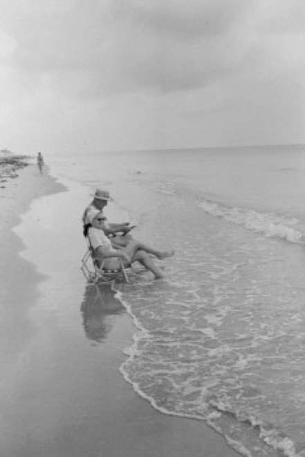 Senior couple sitting on the beach Poster Print - Item # VARSAL25534870