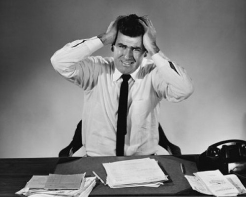 Businessman suffering from a headache Poster Print