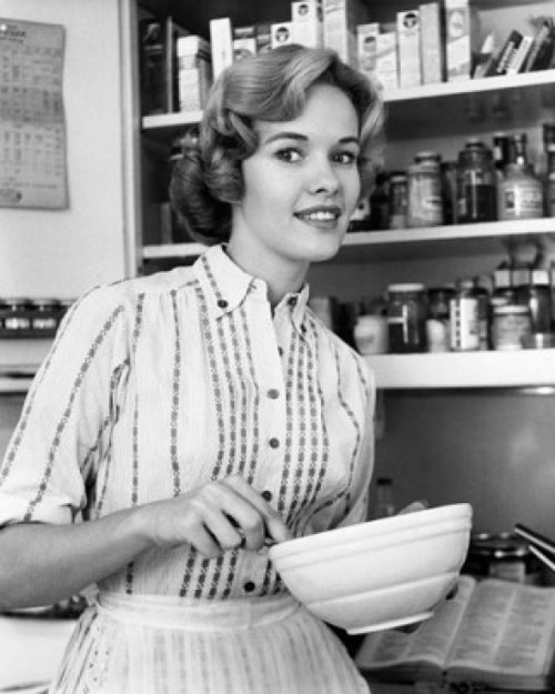 Young woman holding a bowl and smiling Poster Print - Item # VARSAL25535472