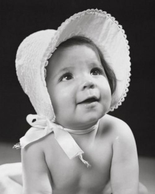 Close-up of a baby girl wearing a bonnet and smiling Poster Print - Item # VARSAL255628B