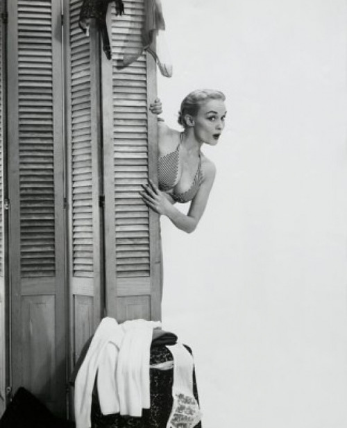 Young woman peeking from behind a screen partition Poster Print - Item # VARSAL2551193