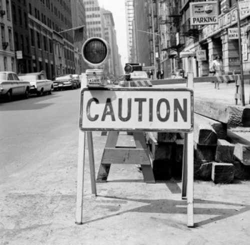 Caution sign on city street Poster Print - Item # VARSAL255420517