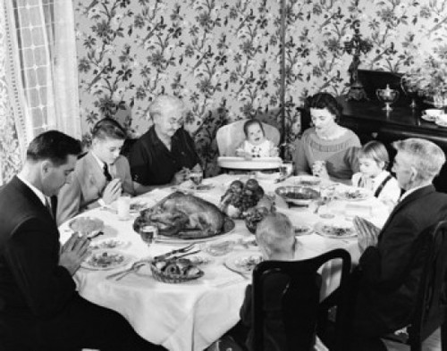 Family praying at dining table on Thanksgiving Day Poster Print - Item # VARSAL25524018