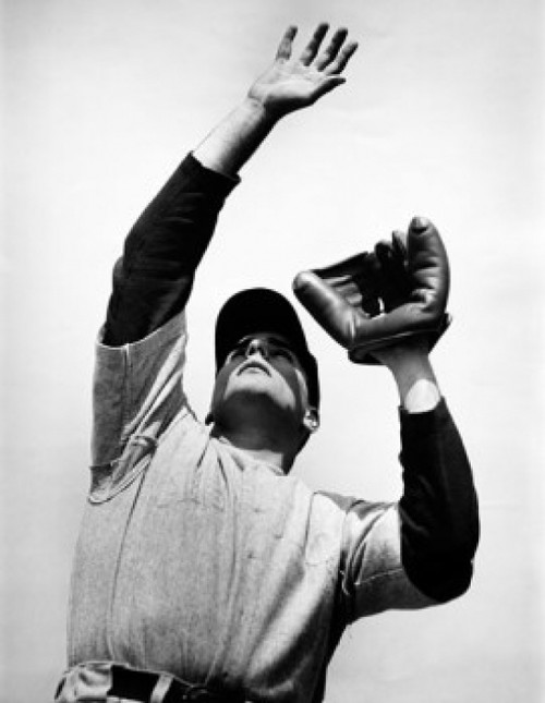 Low angle view of a baseball player catching a ball Poster Print