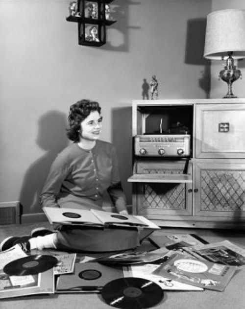 Teenage girl sitting on the floor with records around her Poster Print - Item # VARSAL2552593