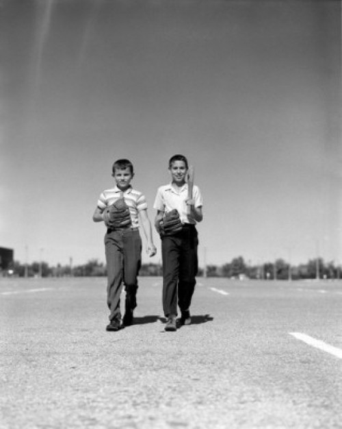 Two boys with baseball glove and bat waling on parking lot Poster Print - Item # VARSAL25516299